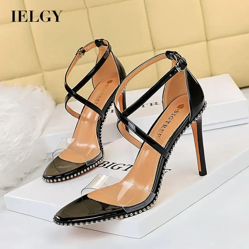 

IELGY metal rivet high heels women open toe hollow cross strap