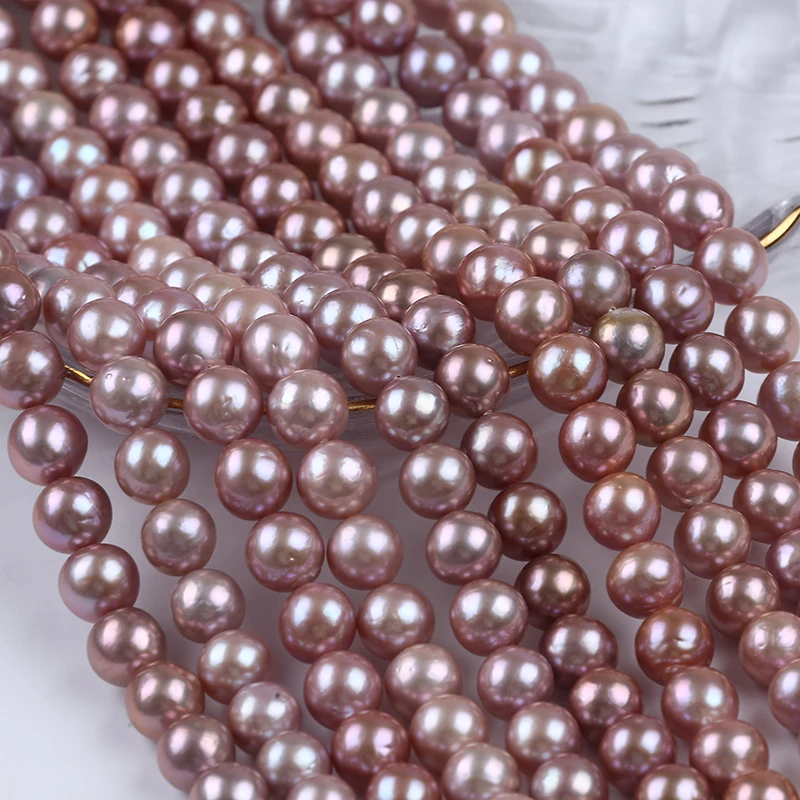 

Natural Purple 10-11mm Round Freshwater Pearl Strand For Jewelry Making