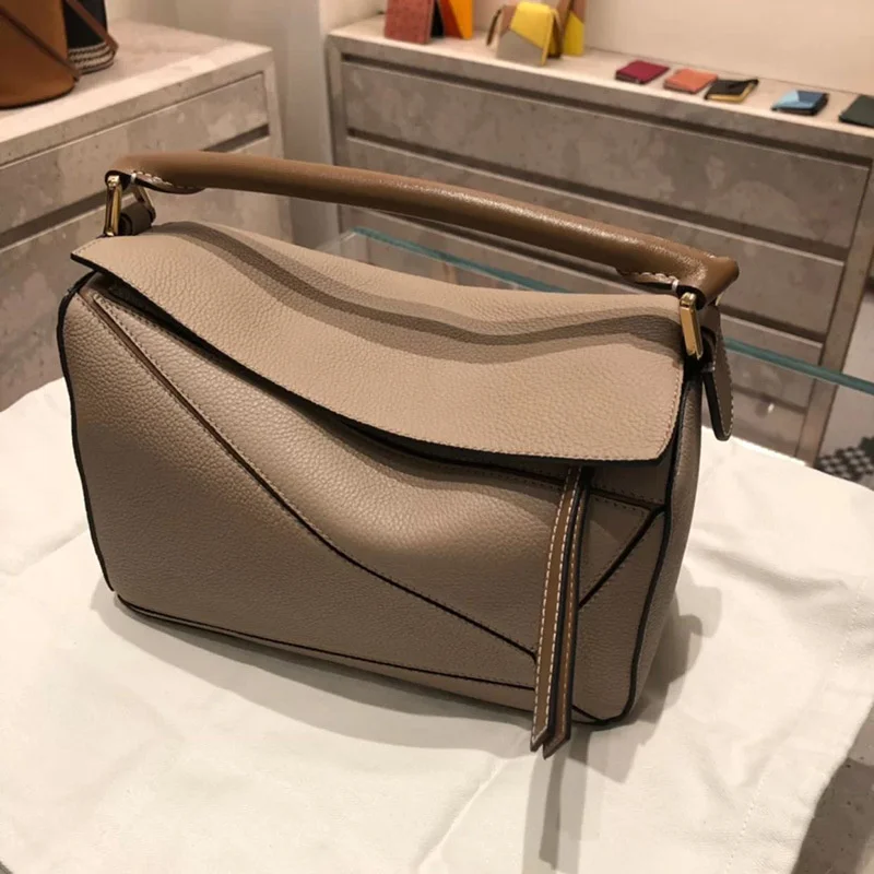 

high quality luxury brand 2023 new puzzle geometric net red same diagonal hand leather women's splicing pillow bag