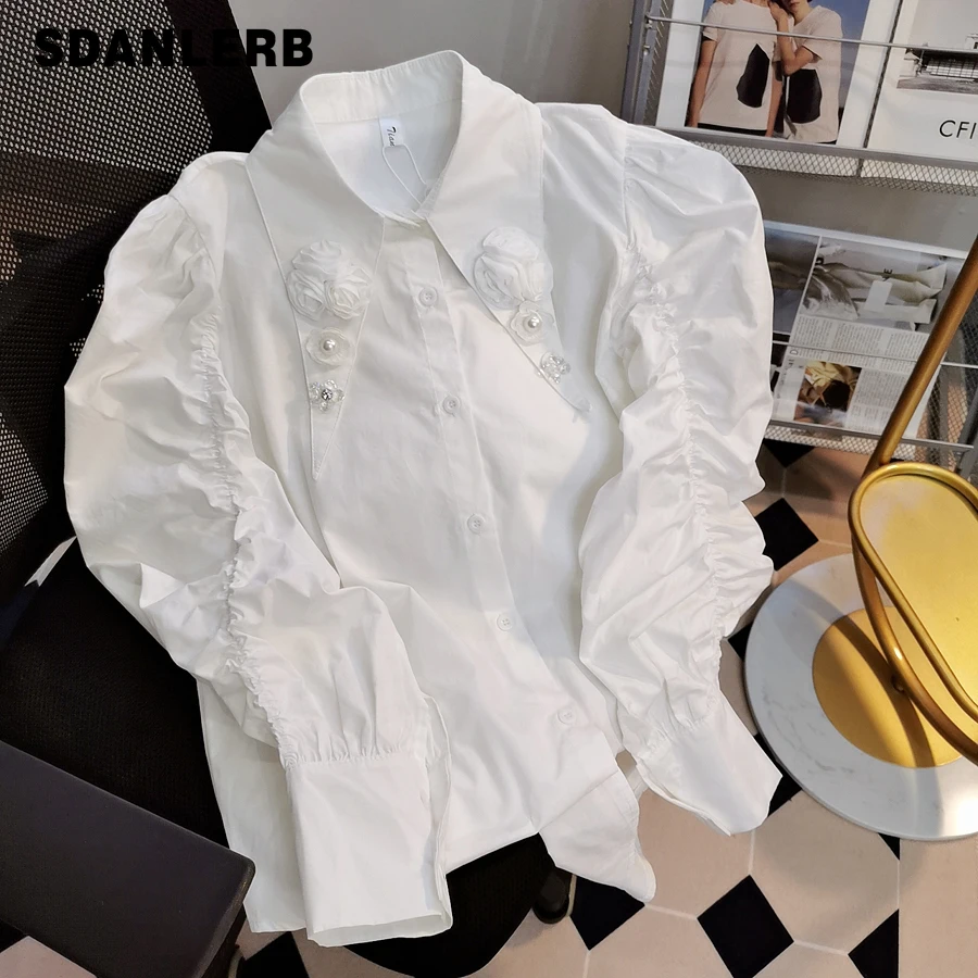 

Белая нижняя рубашка для женщин, новинка весны 2022, блузка для тяжелой промышленности, элегантный топ с буффами и цветочным принтом и острым ...