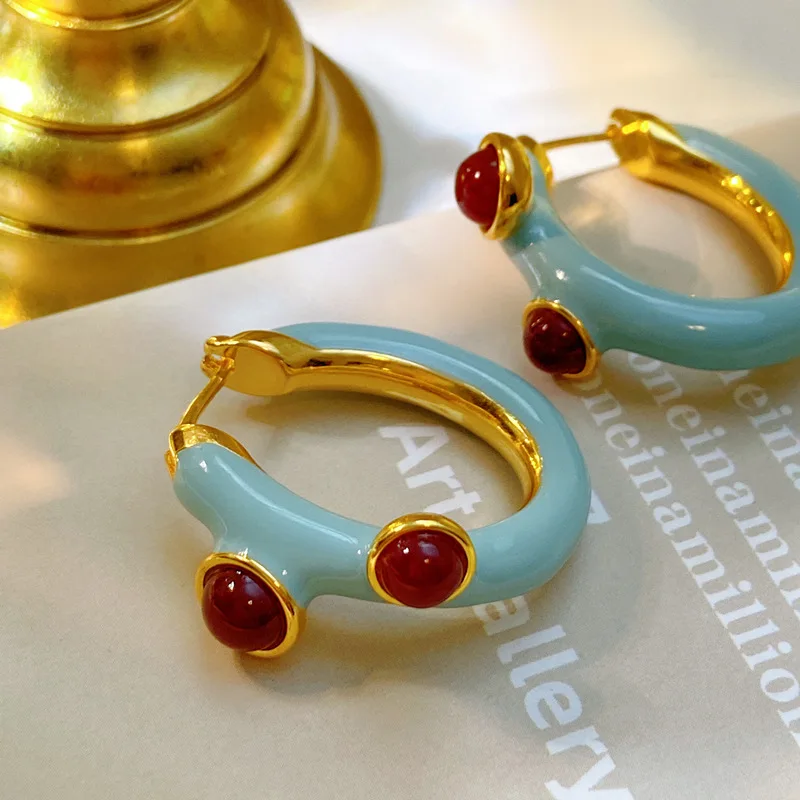 

A new niche design for Fall 2022 is retro chic earrings with blue medieval enamel buckle earrings