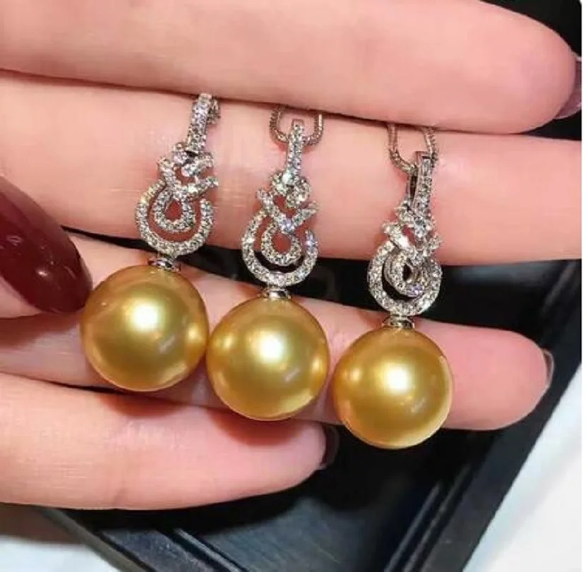 

Великолепные серьги AAAAA 10-11 мм с золотым фотоэлементом в Южном море 925 С.