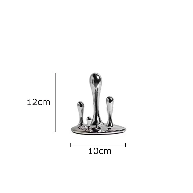 

Серебряная скульптура капель воды из смолы