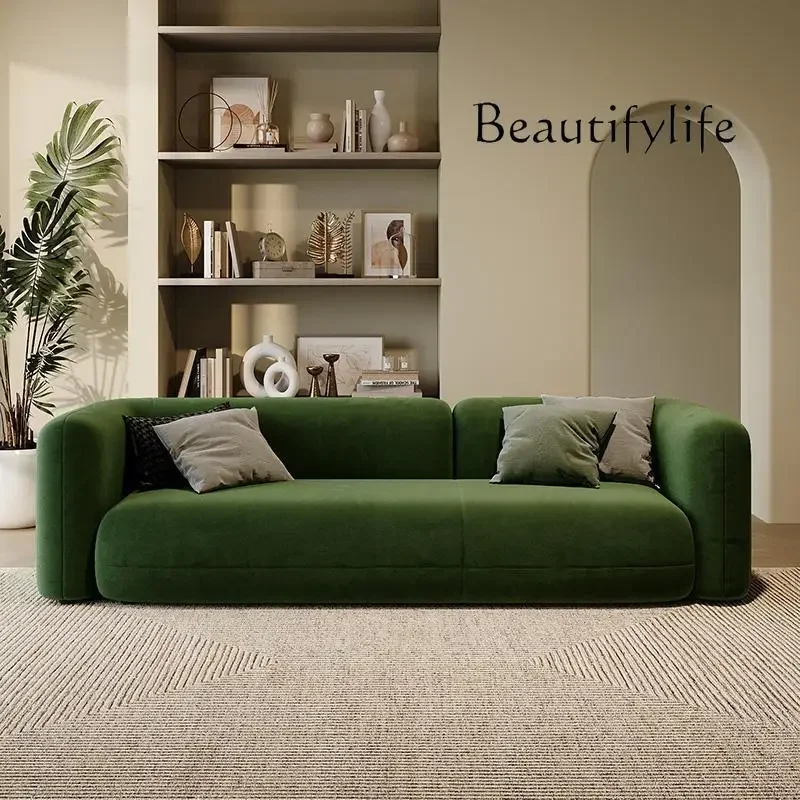 Магазин одежды квартира гостиная темно-зеленый тканевый диван современный