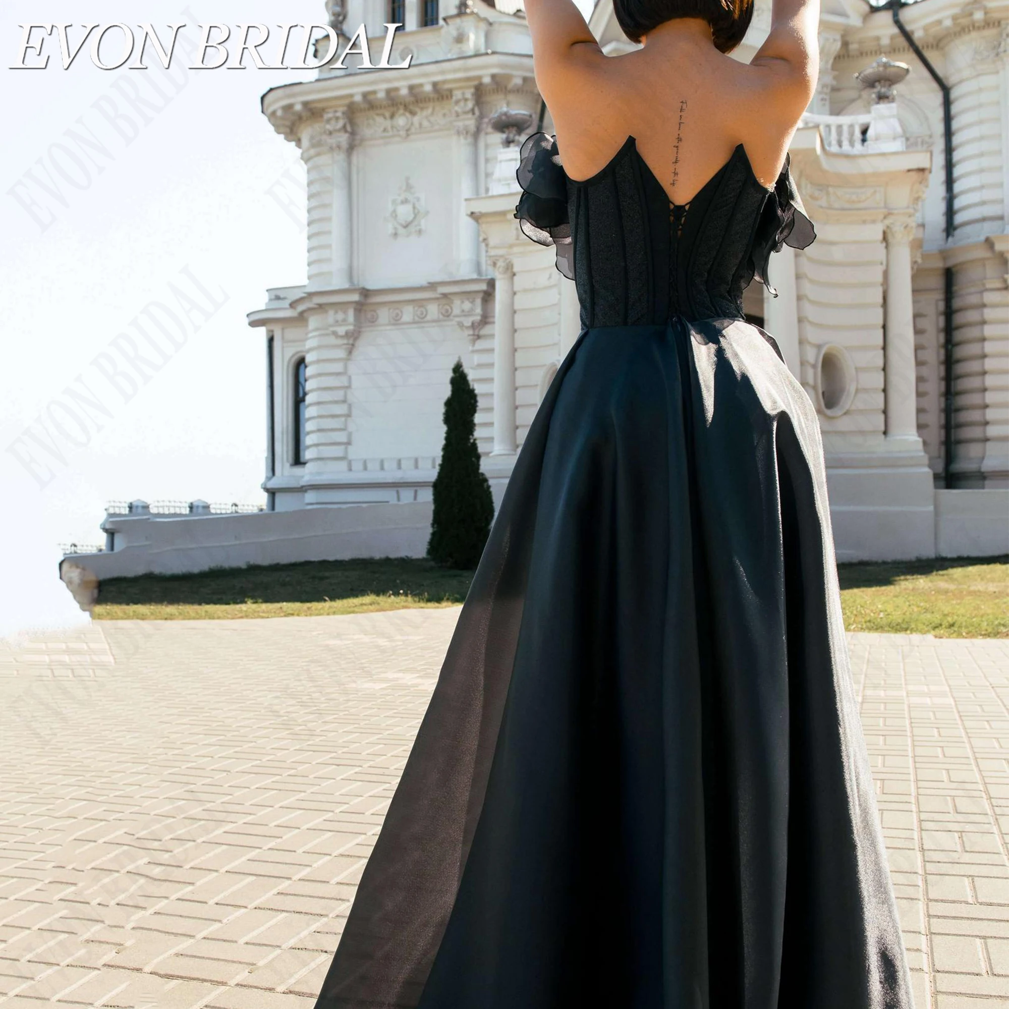 Фото EVON BRIDAL Элегантное вечернее платье без бретелек корсет из органзы с объемными цветами для гостя свадьбы коллекция 2026 на заказ легкая воздушная силуэт объемные цветочные декоры полупрозрачная ткань с уникальной №5