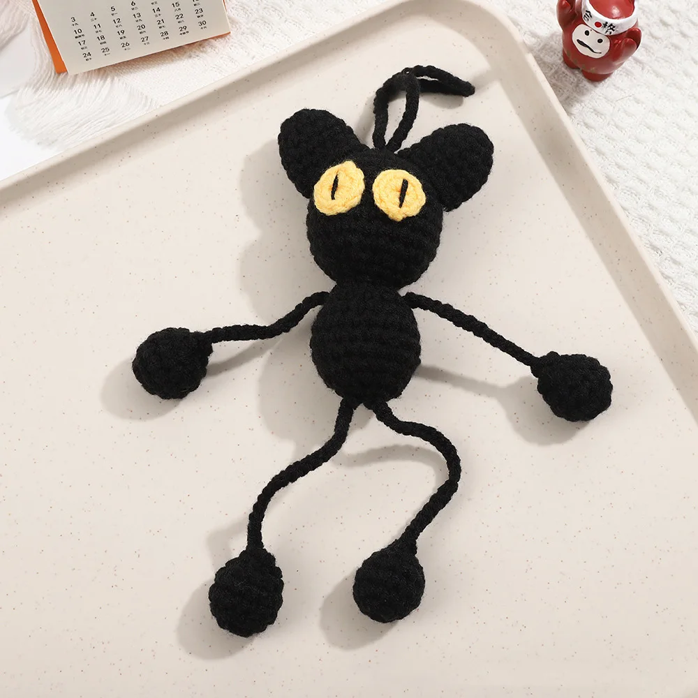 

Вязаная шерстяная кукла черный кот