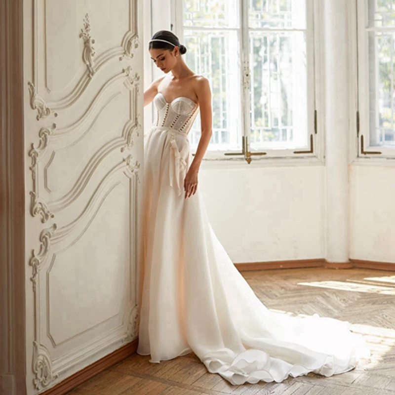 

Elegant Sweetheart Beaded Pearls Wedding Dress New Arrivel Bige Chiffon Long A-line Bridal Dresses Side Bow Pocket Bridal Gowns