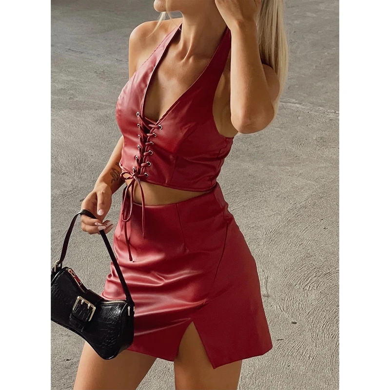 

Женский комплект из топа и юбки, короткий топ из искусственной кожи на шнуровке с лямкой на шее и V-образным вырезом и Однотонная юбка с разре...