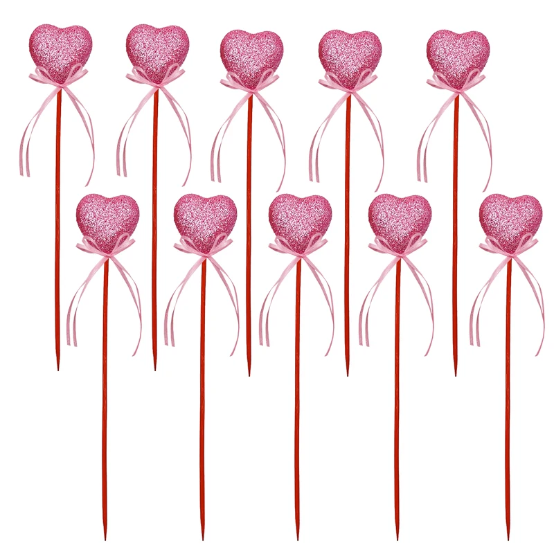 

Розовые украшения в форме стрелы любви