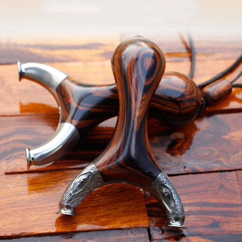 

Titanium Alloy Slingshot Wooden Handle with Flat Rubber Band High Quality Design Slingshot for Outdoor Shooting