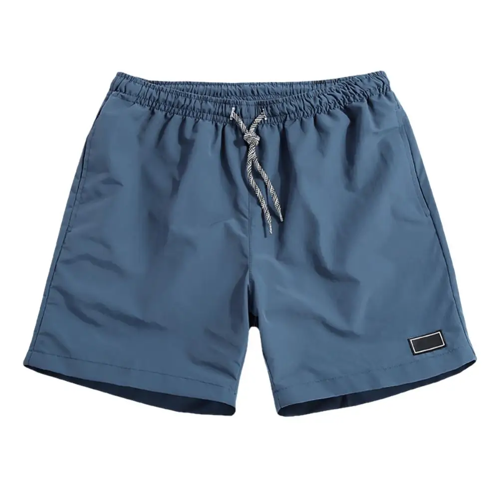 

Men Casual Breathable Quick Dry Pants Pockets Beach Solid Color Sport Shorts