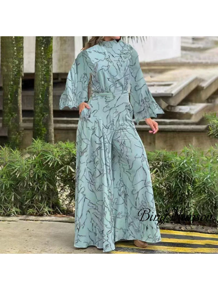 2023 Women's New Spring/Summer Elegant Waist Tie Up Long Sleeved Short Sleeved Hanging Neck Pants Printed Flare Pants Jumpsuit
