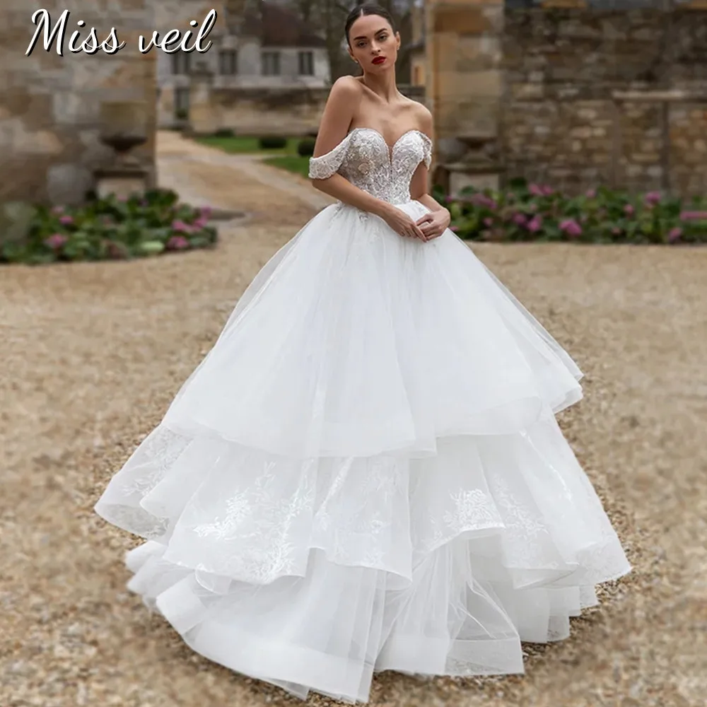 

Miss Veil Tulle Wedding Dress Off Shoulder Lace Up Bohemian Tiered Bridal Gown With 3D Appliques Sweep Train Vestido De Novia