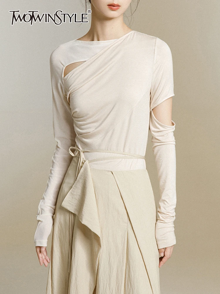 

TWOTWINSTYLE Hollow Out T Shirts For Women Round Neck Long Sleeve Slimming Asymmetrical Solid Casual T Shirt Female Fashion 2023