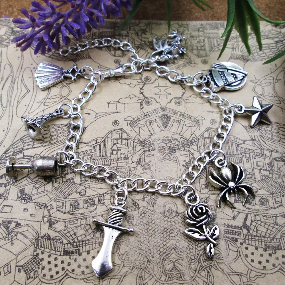 

Tv Series Magic Dragon Arthur Wizard Inspired Sword Spider Flower Charm Bracelet