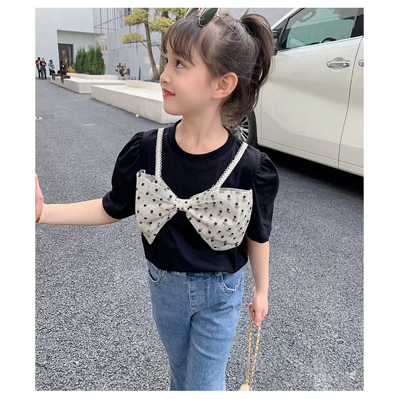 

Комплект одежды для девочек 2022, модная новинка в Корейском стиле, летняя черная футболка с бантом для девочек + джинсовые брюки с расклешенн...