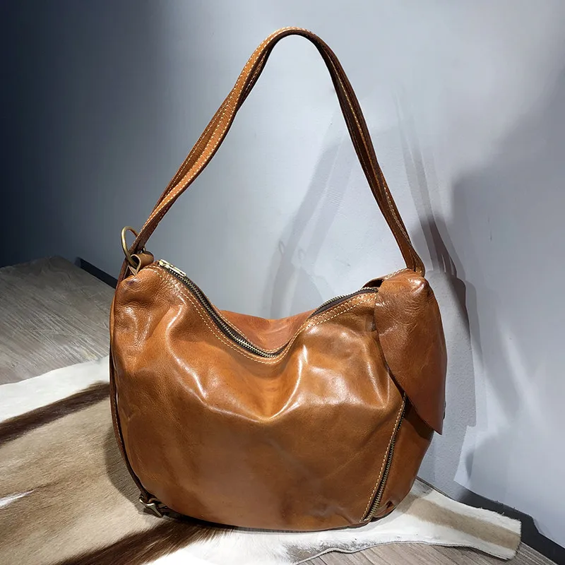 

Retro fashion first layer cowhide ladies armpit bag simple casual designer natural genuine leather ladies shoulder bag female