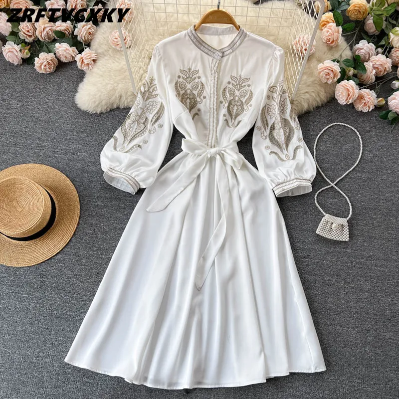 

Fashion Hollow Out Embroidery Women White Dresses High Quality Stand Collar Lantern Sleeve Lady Lace Up Belt Vintage Midi Dress