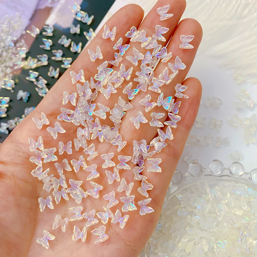 

100pcs 3D Aurora Butterfly Nail Art Charms Resin Butterfly Bow Wings Mini Aurora AB Color 3D Charms DIY Kawaii Nail Decoration