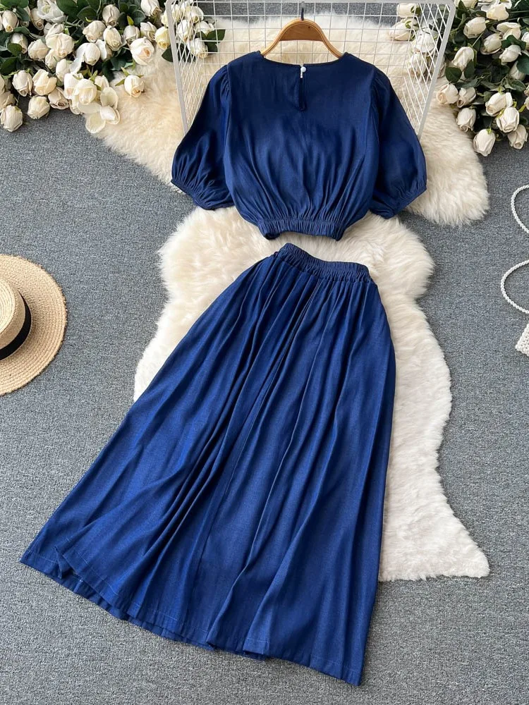 

Летний женский однотонный костюм, винтажный женский топ с коротким рукавом и эластичной талией, повседневная юбка А-силуэта, Модный женский комплект из 2 предметов с круглым вырезом