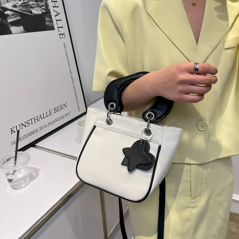 

2022Fashionable and Atmospheric Handbag Diagonal Bag Shoulder Bag Heart Star Pendant Wallet PU and Canvas Stitching Ladies Bag