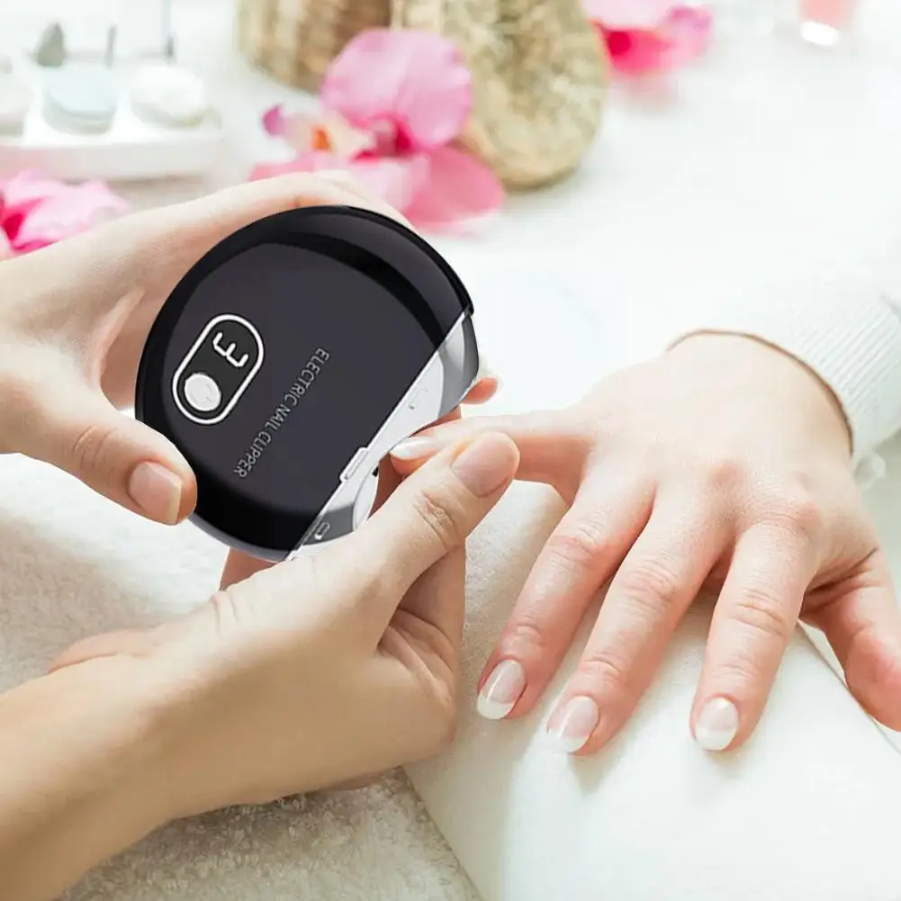 

Электрический автоматический бритвенный станок для ногтей для взрослых и детей, бритвенный станок для ногтей с защитой от брызг Ma C8M9