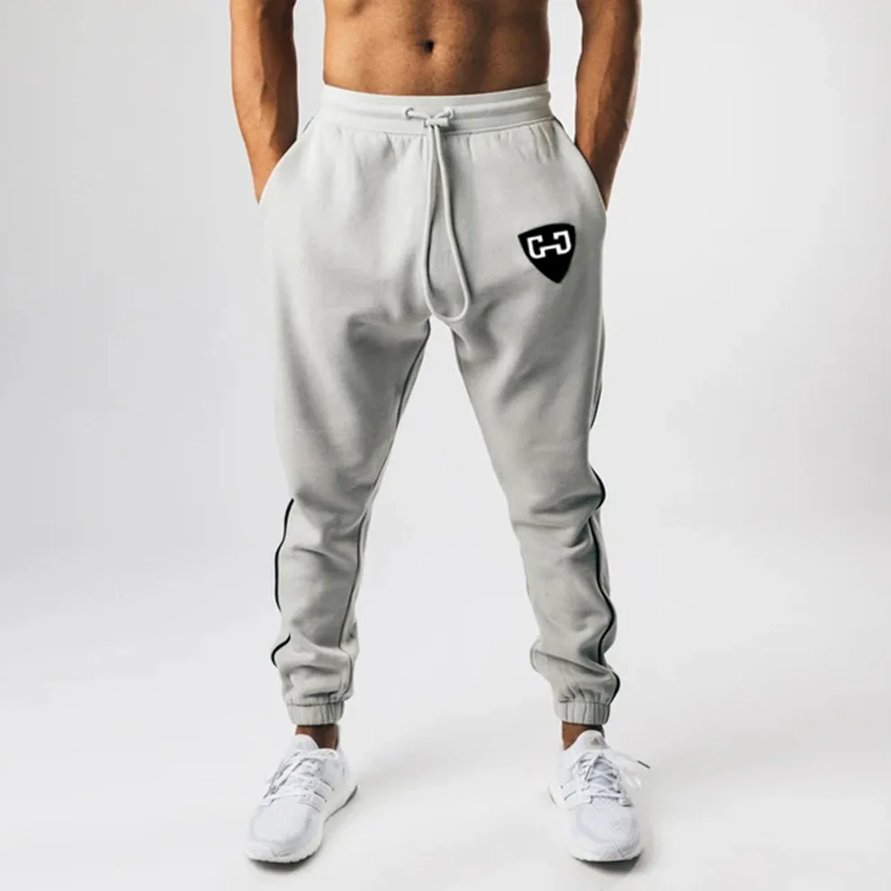 

Autumn and winter new casual sports pants men's European and American running training beam mouth small feet basketball pants