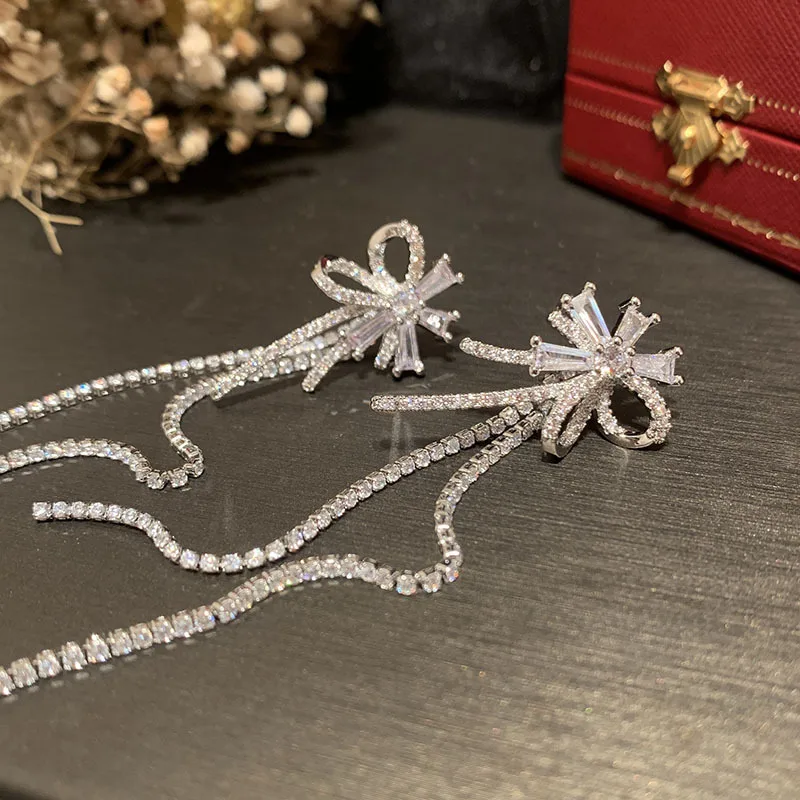 

Japan and South Korea INS long tassel flower earrings front and rear dual-use super fairy hollow bow sweet zircon petal earrings