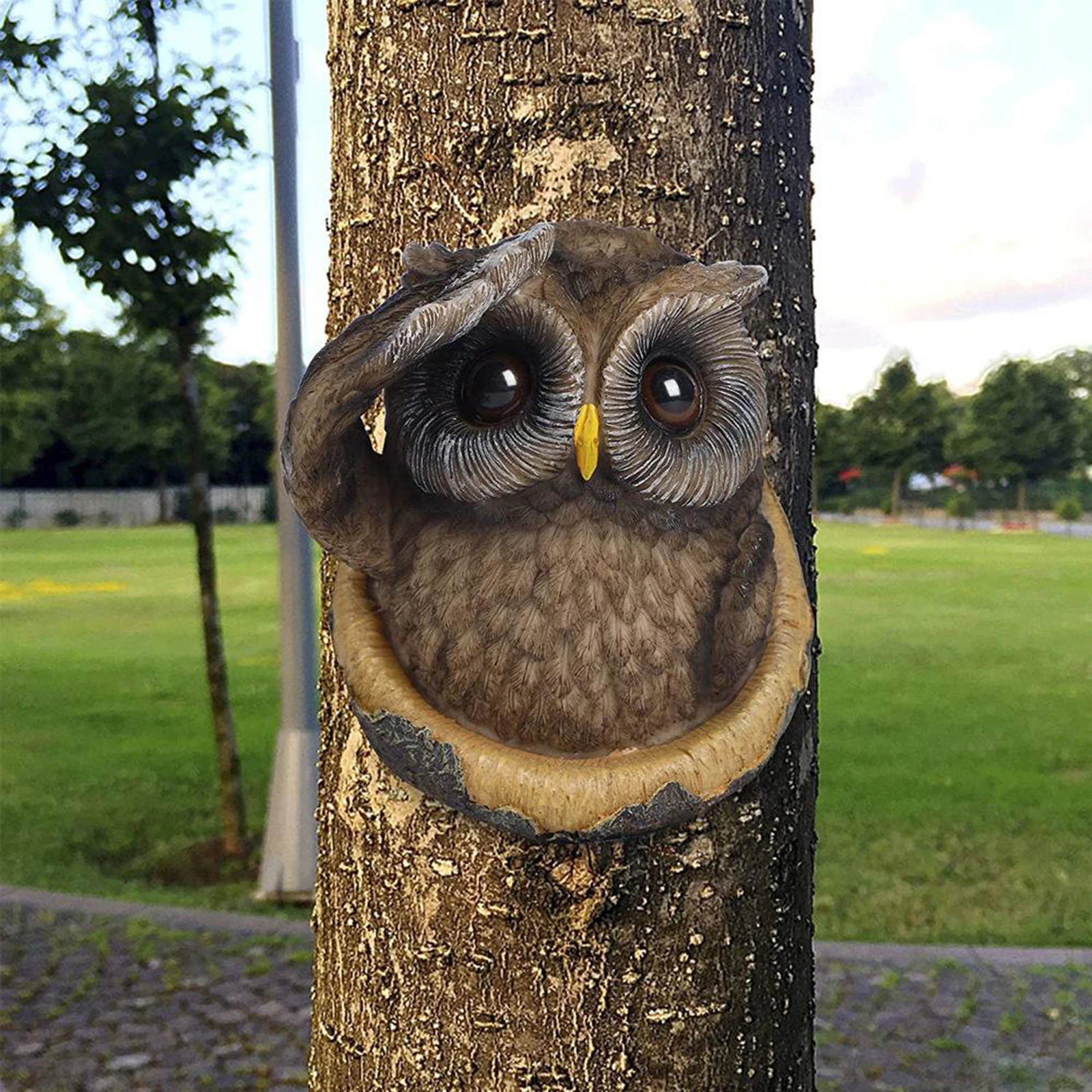 

Декоративная фигурка на дереве в виде совы