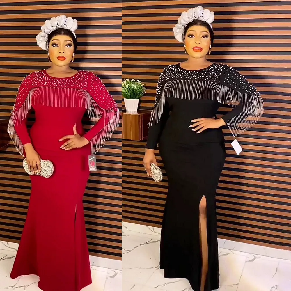 

Платье-макси с длинным рукавом, круглым вырезом и кисточками