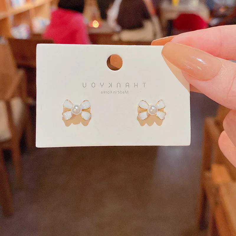 

S925 Silver Needle Mini Simple Seven Bow Earrings Trendy And Versatile Temperament Minority Oil Drop Earrings Earring Bridal