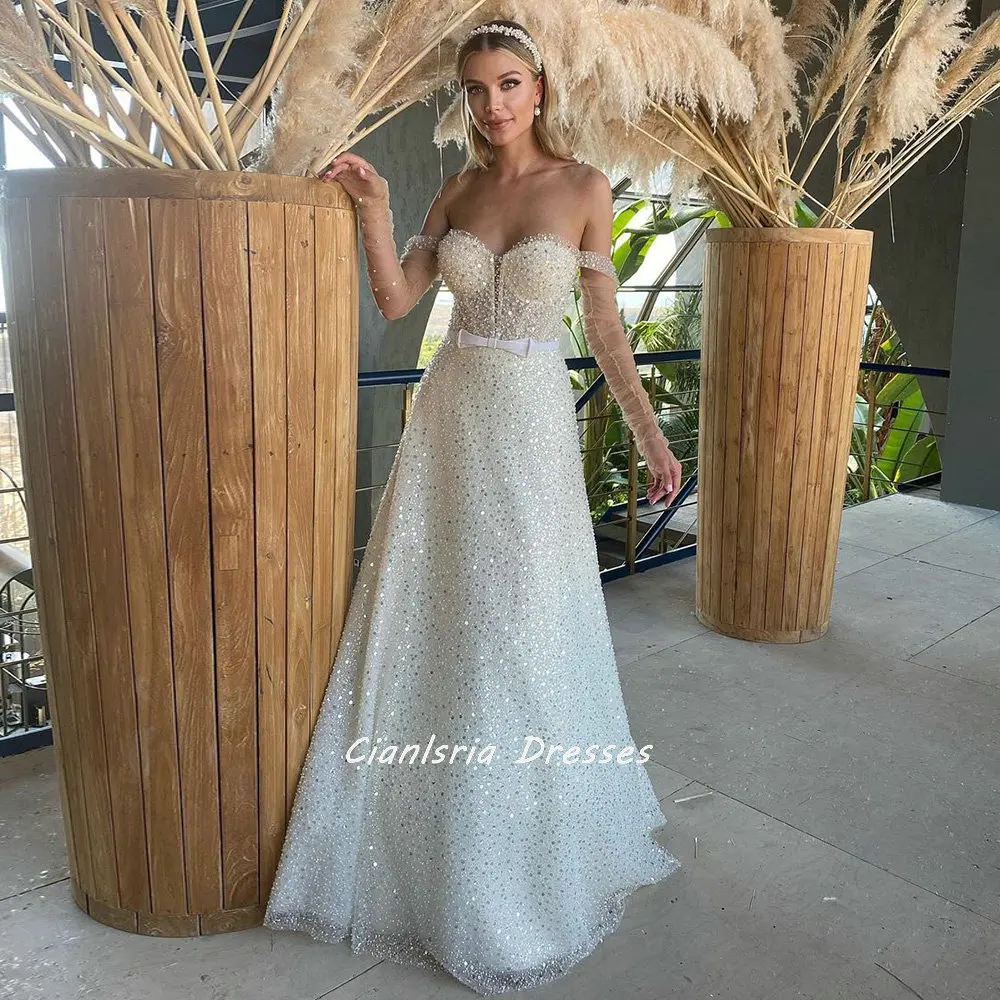 

Sparkly Crystal Off The Shoulder Dubai A-Line Wedding Dresses Long Sleeve Sequined Beading Bow Sahses Saudi Arabic Bridal Gowns