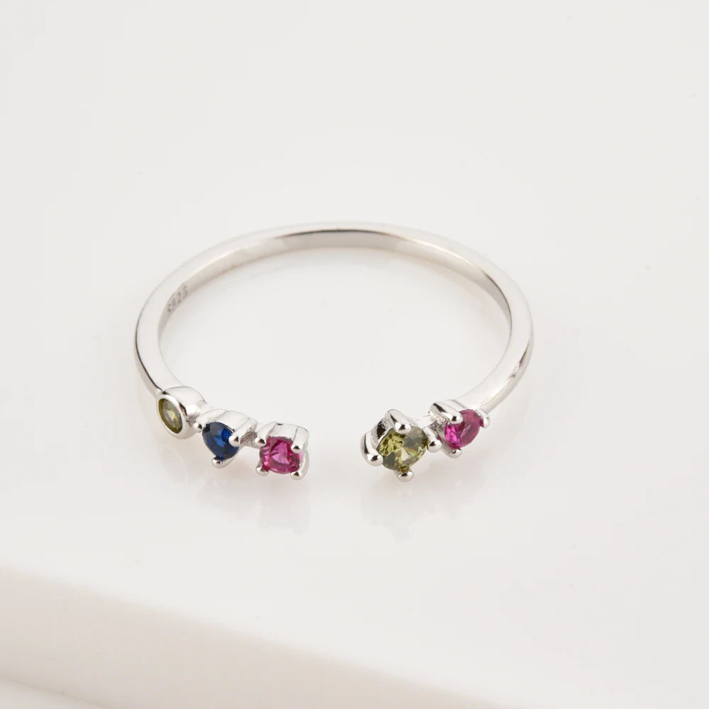 Кольцо женское регулируемое из серебра 100% пробы с радужным кубическим цирконием