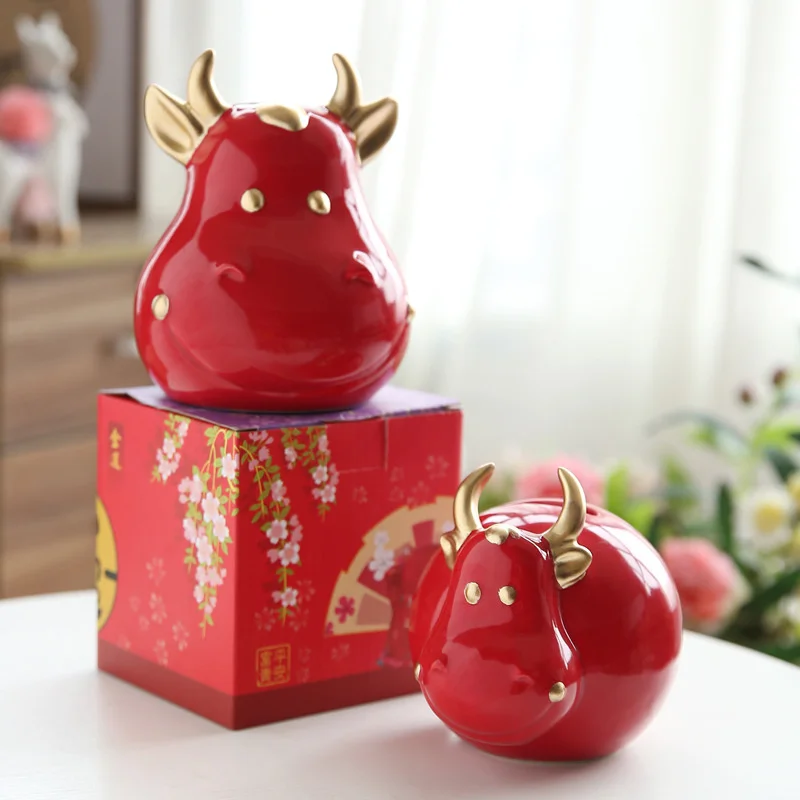 

Ceramic shengxiaoniu creative decoration Red Bull children's Piggy Bank Piggy bank opening with hand made new year gifts