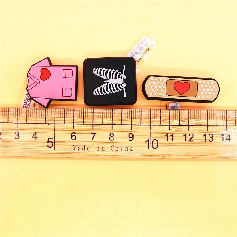 Original 1pcs Band-aid PVC Shoe Charms Decorations Pins Chest X-ray Designer Shoes Buckle Accessories Badges Croc Accessory Jibz images - 6