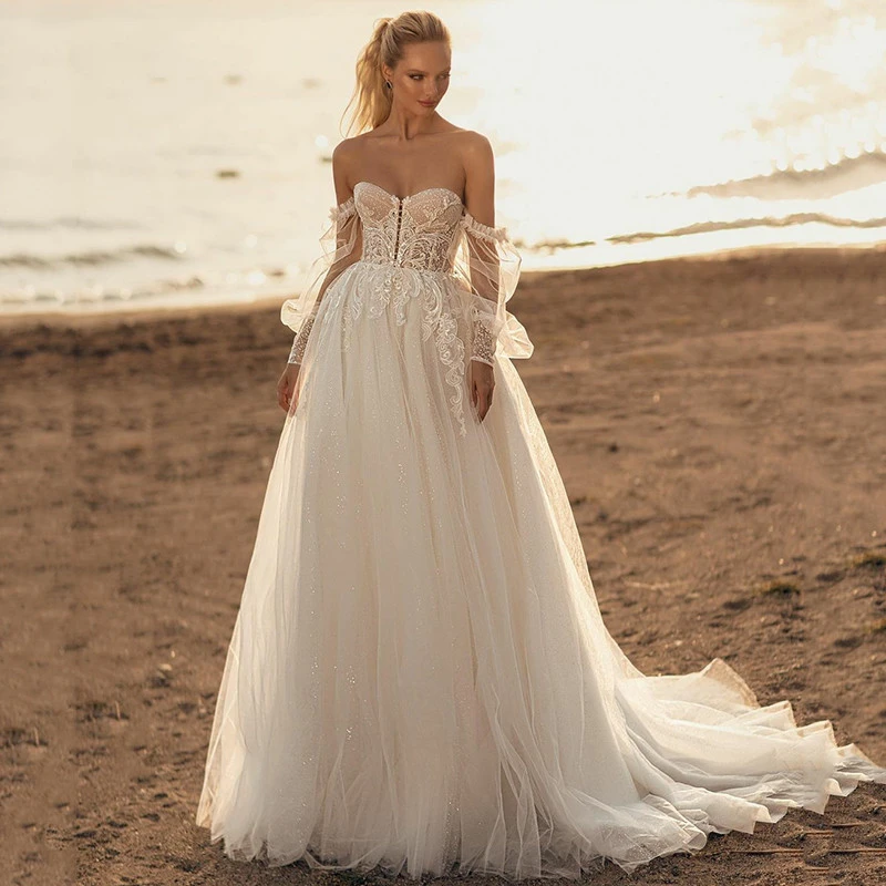 

Изящное ТРАПЕЦИЕВИДНОЕ свадебное платье в стиле бохо с изящной милой кружевной аппликацией из тюля с длинными пышными рукавами Свадебные п...