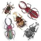 Эмалированная брошь в виде жуков