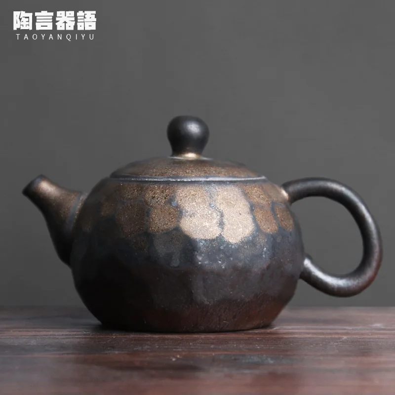 

Japanese-style kiln blackened gold hammer pattern Xishi teapot raw ore pottery handmade pottery kung fu hand-held tea maker sing