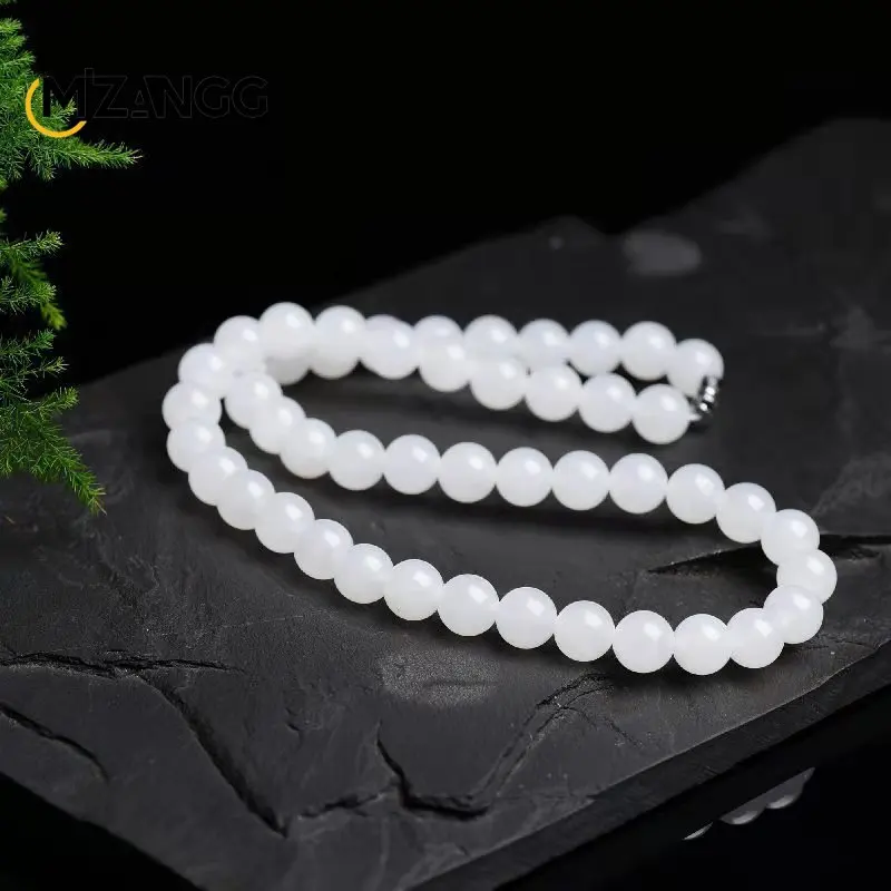 

Ожерелье из белого нефрита и золотистого шелка с круглыми бусинами