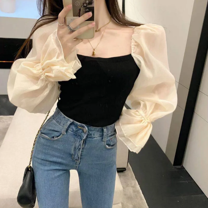 

Autumn and Winter New Design Sense of Niche Splicing Careful Machine Side Collar Exposed Clavicle Off Shoulder Bubble Sleeve Top