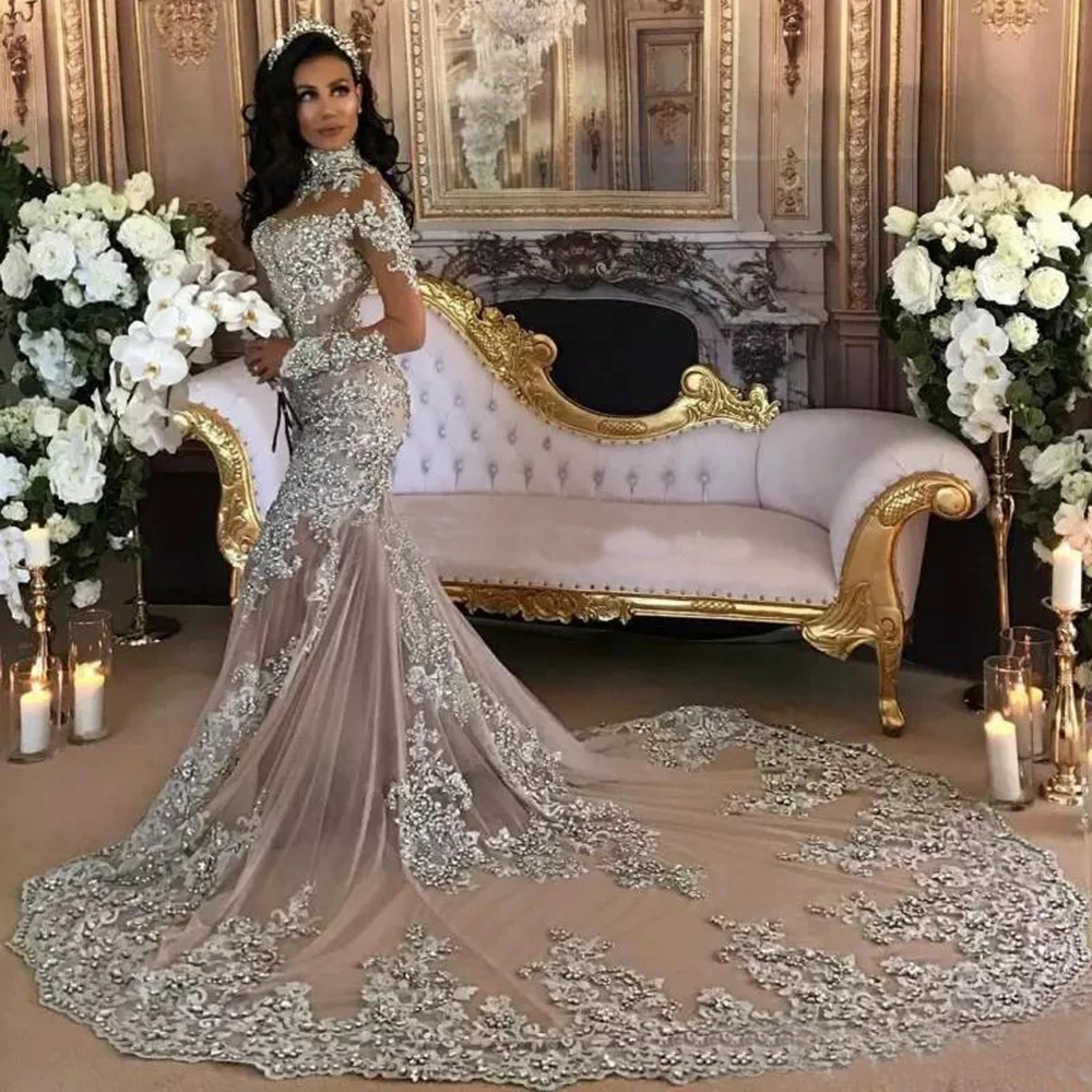 

Dubai Arabic Luxury Sparkly Wedding Dresses Sexy Bling Beaded Lace Applique High Neck Illusion Long Sleeves Mermaid Dress