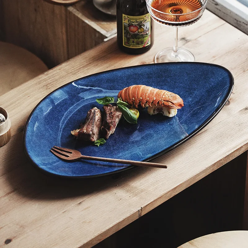 

Japanese Retro Western Cuisine Plate Glaze Kiln Ceramic Plate Irregular Oval Fish Dish Steak Plate Sushi Plate