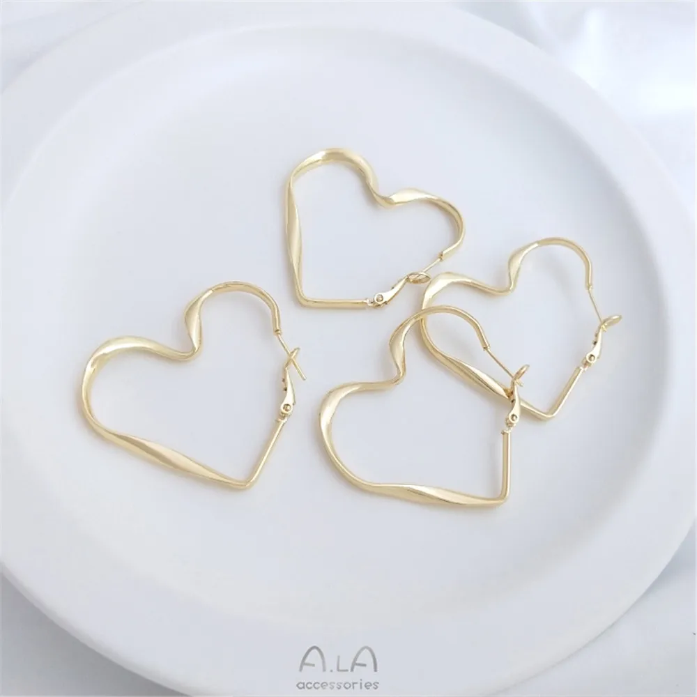 

14K gold wrap fashion twist ribbon peach heart earrings 925 silver pin heart spring buckle ear pin earrings