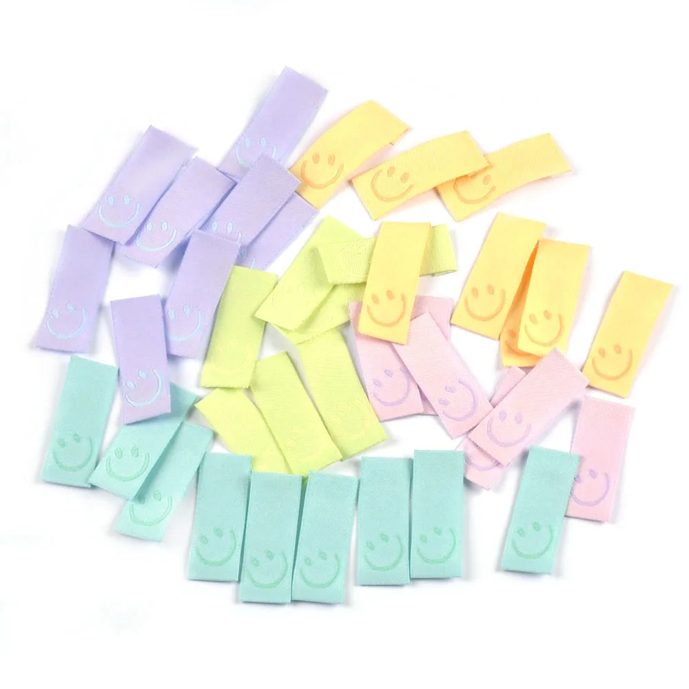 50Pcs New Candy Color Embroidery Smile Labels For Sewing Accessories Clothes Washable Care Garment Bags Tags DIY Supplies c3513