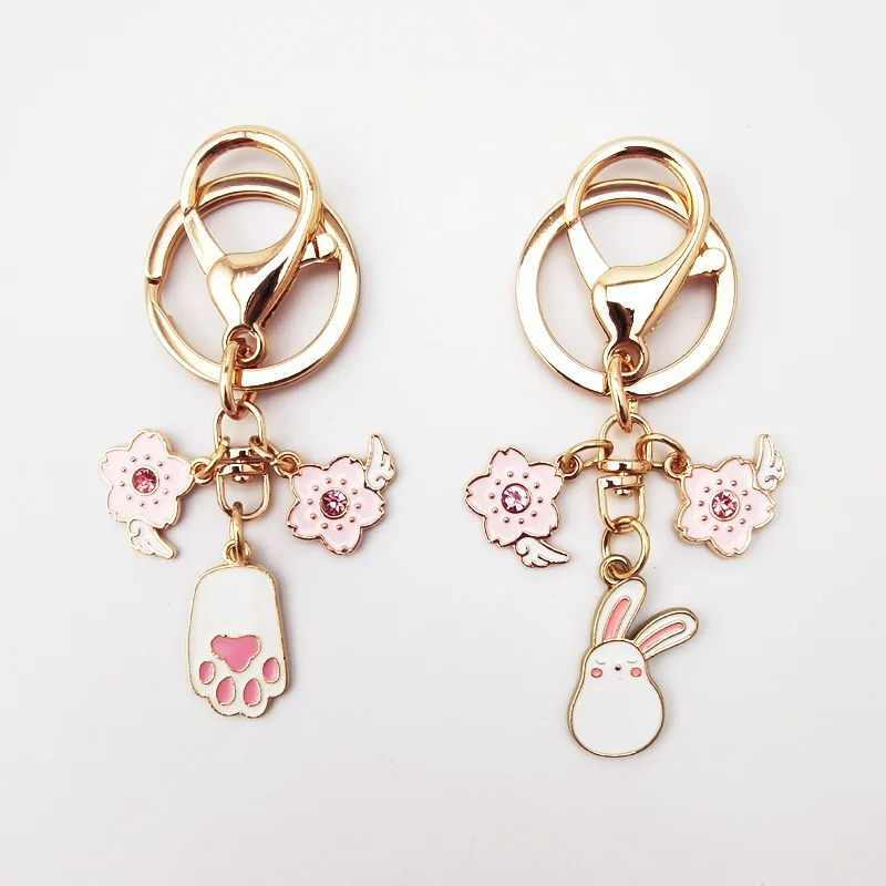 

Маленькая белая искусственная кожа мультяшный милый розовый цветок вишни бриллиантовые маленькие крылья Высокое качество Подвеска подаро...