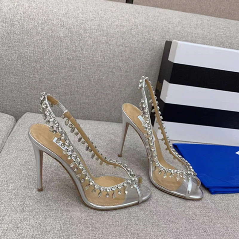 

2023 Spring and summer new European and American women's fish mouth high heels transparent rhinestone fashion banquet shoes