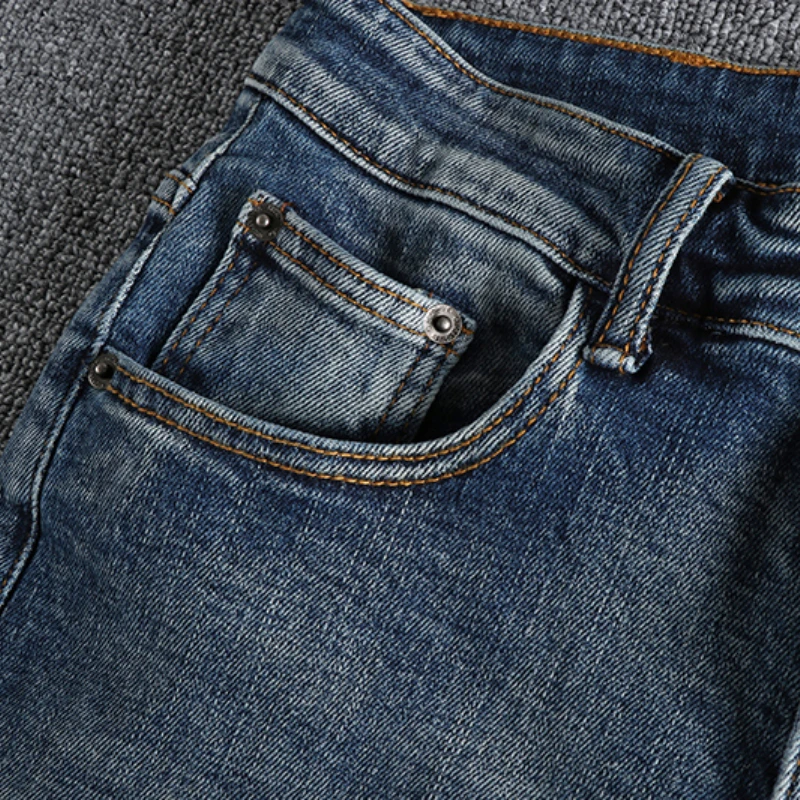 Simple retro jeans with old holes, men's personalized trousers with rotten edges, slim feet, nine-minute pants and boots.