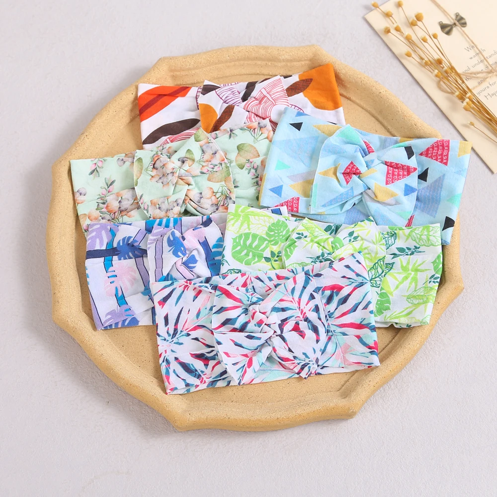 

Повязка на голову детская нейлоновая эластичная с бантом и принтом