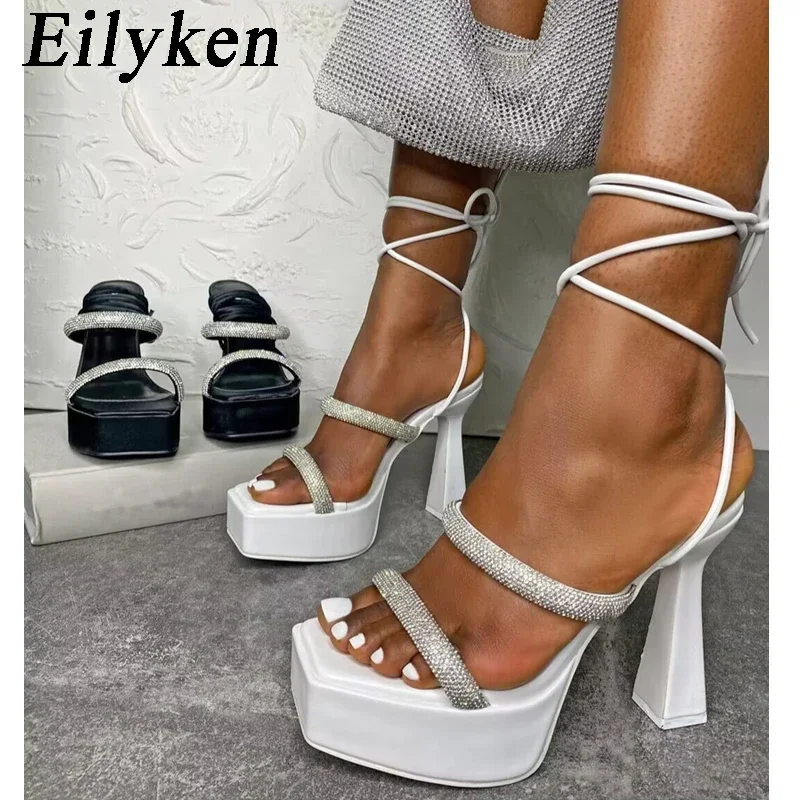 

Eilyken/Новинка; Обувь на не сужающемся книзу массивном высоком каблуке со стразами; Модные женские сандалии в римском стиле на платформе с перекрестной шнуровкой