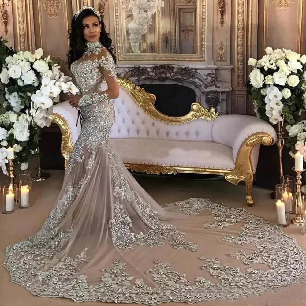 

Dubai Arabic Luxury Sparkly Wedding Dresses Sexy Bling Beaded Lace Applique High Neck Illusion Long Sleeves Mermaid Bridal Dress